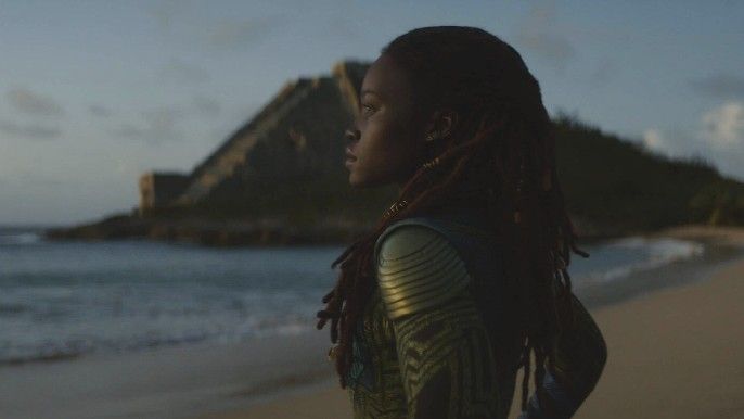 Lupita Nyong'o as Nakia looking across the sea in Black Panther: Wakanda Forever