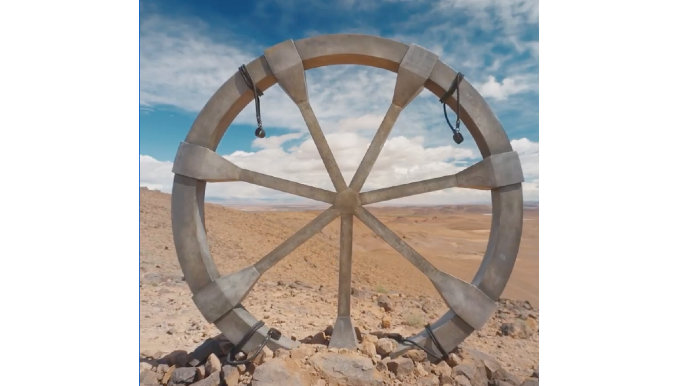 the wheel of time season 2 filming location with wheel in sand