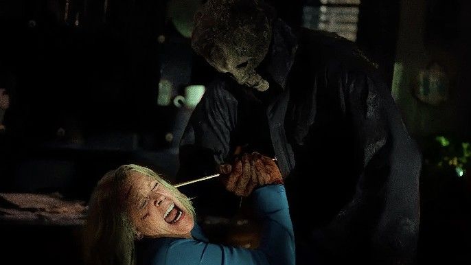 Michael Myers tries to stab Laurie (Jamie Lee Curtis) with a knitting needle in Halloween Ends