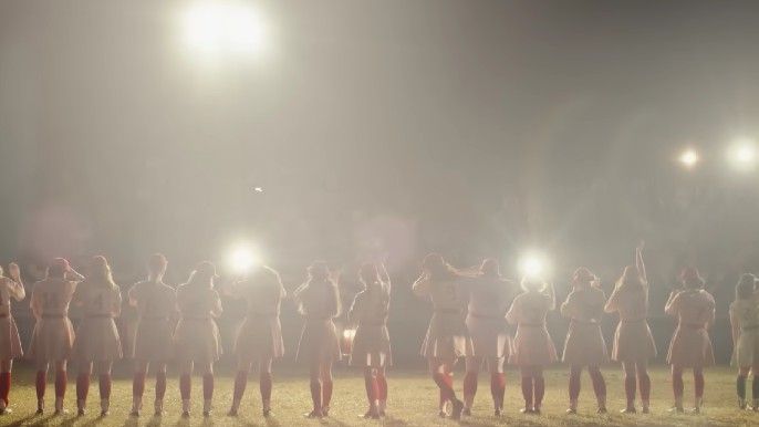 A League of Their Own show silhouette of women facing audience celebrating win in baseball