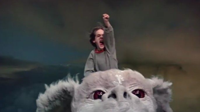 Barret Oliver as Bastian Bux riding Falkor in The NeverEnding Story