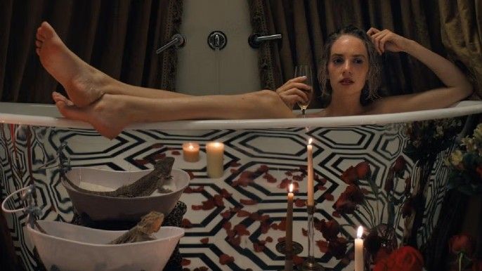 Do Revenge Maya Hawke as Eleanor inside a tub holding a wine glass