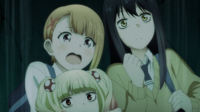 Miko, Hana, and Yulia looking scared inside a haunted house.