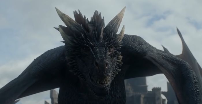 Game of Thrones Dragon in front of Jon Snow.