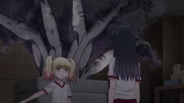 Miko and Yulia talking, and a large ghost behind them.