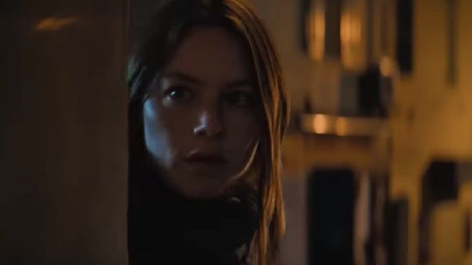 Camille Rowe as Roxana Aubrey spies on Pascal in No Limit
