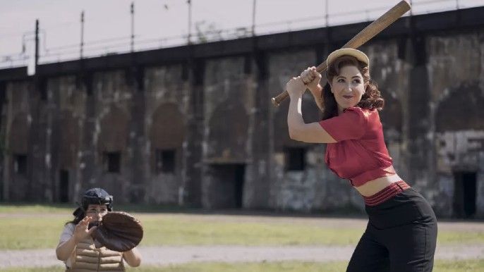 A League of Their Own show official cast photos D’Arcy Carden as Greta playing baseball