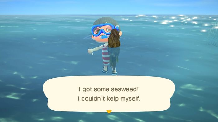An image showing a character in Animal Crossing pulling some seaweed out of the sea. They're displaying it to the camera, with the caption: "I got some seaweed! I couldn't kelp myself"