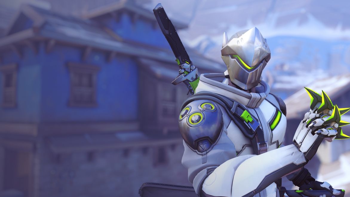 Genji stood in front of a blue building, holding his shuriken, in Overwatch 2.