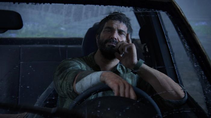 Image of Joel driving a car in The Last of Us Part I.