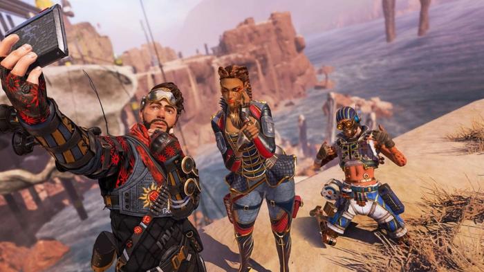 Apex Legends Mirage Loba and Octane taking a selfie in Kings Canyon. They are all wearing red-themed skins.