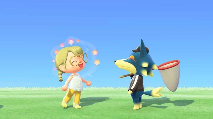 Animal Crossing New Horizons. The player is talking to Wolfgang the Wolf. Wolfgang is on the right and smiling at the player who is expressing joy on the left.