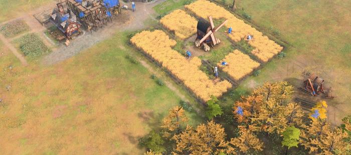 Villagers in Age of Empires 4 farming for food and wood.