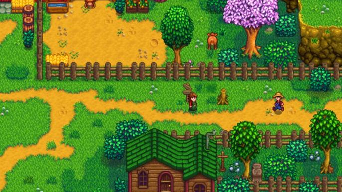 Stardew Valley. The player is walking past a citizens house and the dairy farm. The dairy farm is at the top of the image and the villager's house is at the bottom. The player is walking along a dirt path between the two. 