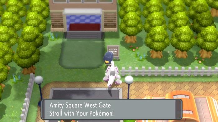 A Pokémon Trainer with their Palkia, about to enter the Amity Square West Gate of Hearthome City, in Pokémon Brilliant Diamond and Shining Pearl.