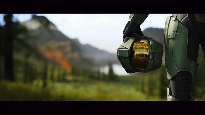 The image of Master Chief holding his helmet by his side in a Halo Infinite promotional shot.