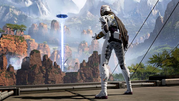 Apex Legends Mobile character, Wraith, wearing a white "voidwalker" space suit, looking out over the mountainous King's Canyon landscape.