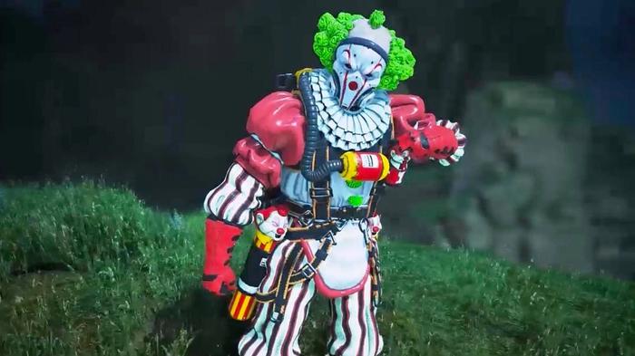 Caustic dressed as a creepy clown, staring at the camera in a dark field.