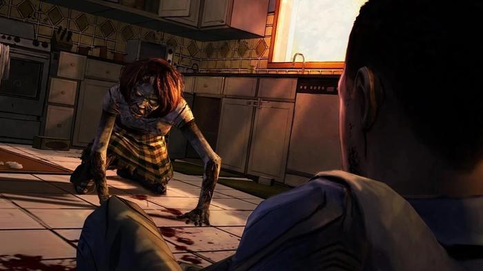 A zombie crawls along the floor towards someone in The Walking Dead: Season One.