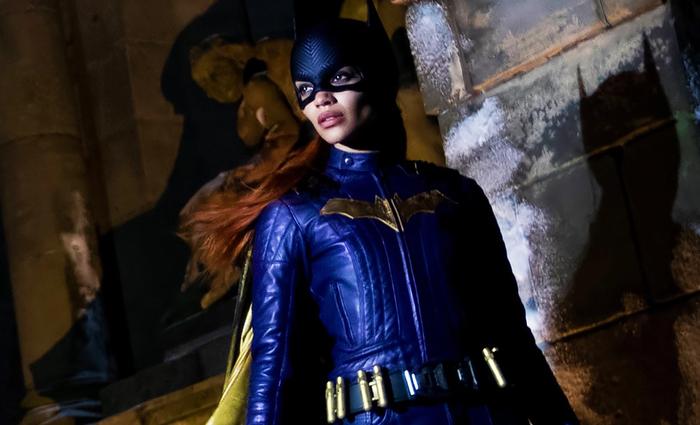 Leslie Grace in the Batgirl costume, which expresses a blue and gold colour scheme.