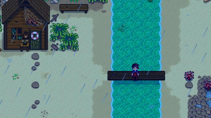 Stradew Valley. The player is standing on the repaired beach bridge to the right of Elliot's house on Pelican Town's Southern Beach.