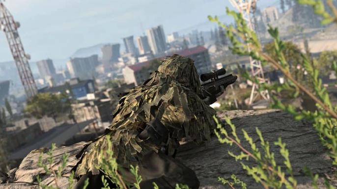 Modern Warfare 2 player wearing ghillie suit and holding sniper