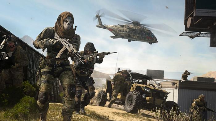 Image showing Modern Warfare 2 players standing near vehicle
