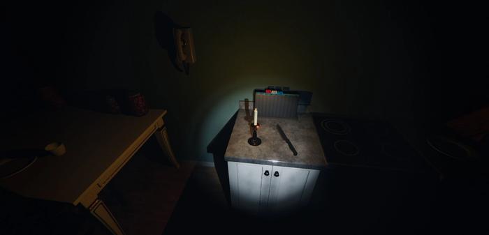 A candle on the kitchen side in Phasmophobia.