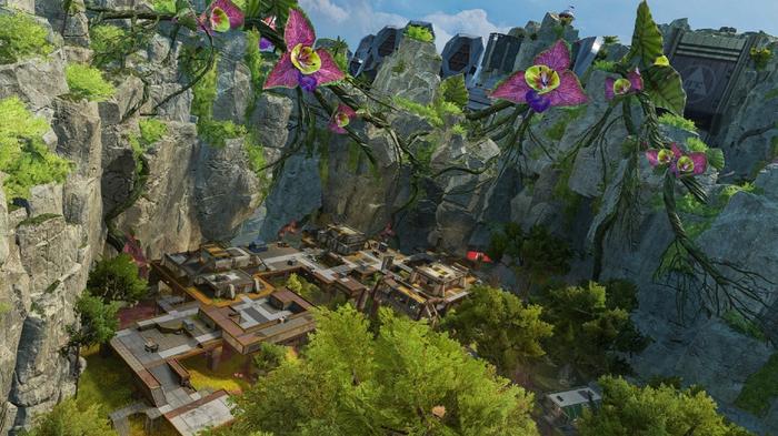 A jungle outpost at the foot of a cliff in Apex Legends.