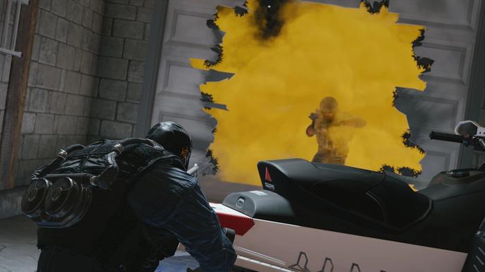 A player aiming into a cloud of smoke at an enemy in Tom Clancy's Rainbow Six Siege.