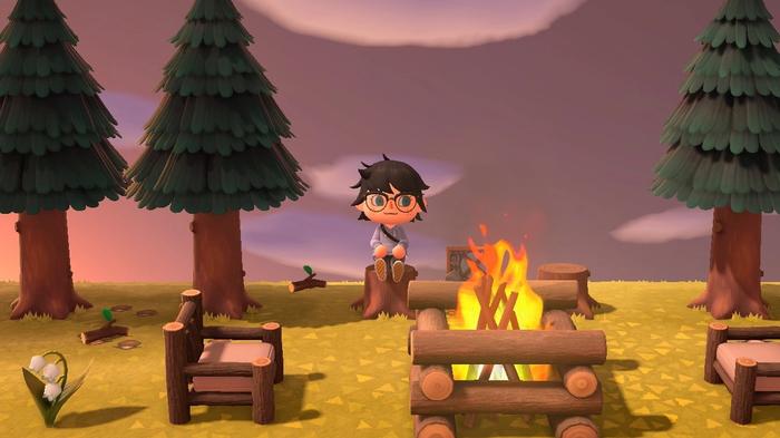 A player sat on a tree stump on their island in Animal Crossing: New Horizons.