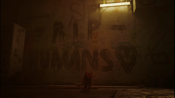 Stray Review: a mural saying "Rip Humans" with a heart beside it
