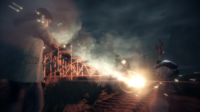 Alan Wake Remastered Screenshot - Night time, shining a lit flashlight onto the Taken.