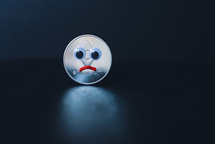Image of an Ethereum coin with a sad face, due to the cryptocurrency prices being down.