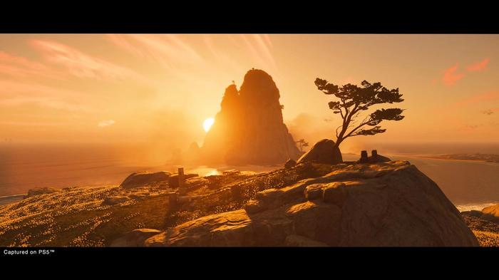 Screenshot from Ghost of Tsushima on PS5 showing the sun setting behind a large mountain