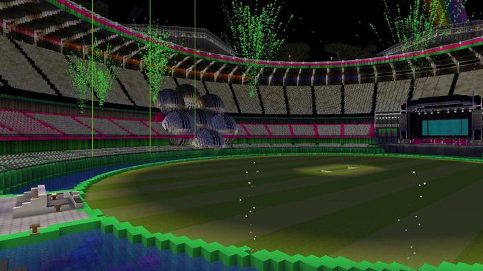 The inside of the Space Bowl, The Hundred's Minecraft cricket stadium. The pond is on the left, with fireworks blasting above the pitch.