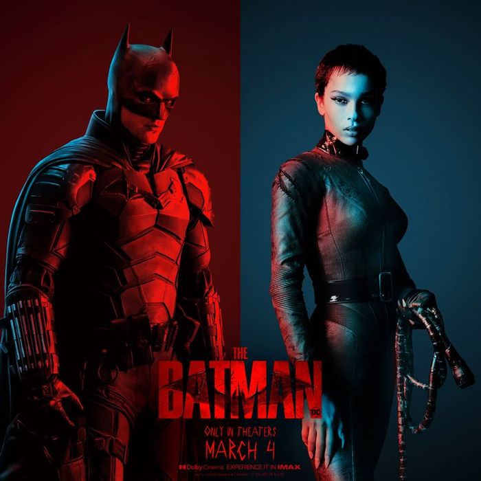 Batman standing in red. Catwoman standing in blue.