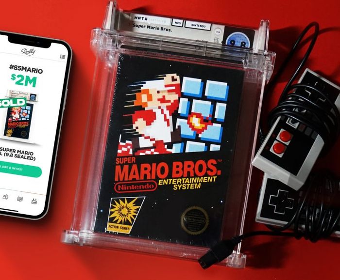 Rally app on a smartphone, sealed copy of Super Mario Bros. on Nintendo Entertainment System, NES controllers with cords wrapped around them.