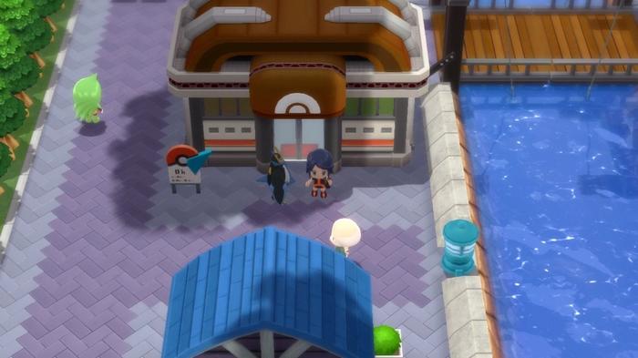 A Pokémon Trainer and their Empoleon stood outside of Canalave City Gym in Pokémon Brilliant Diamond and Shining Pearl.