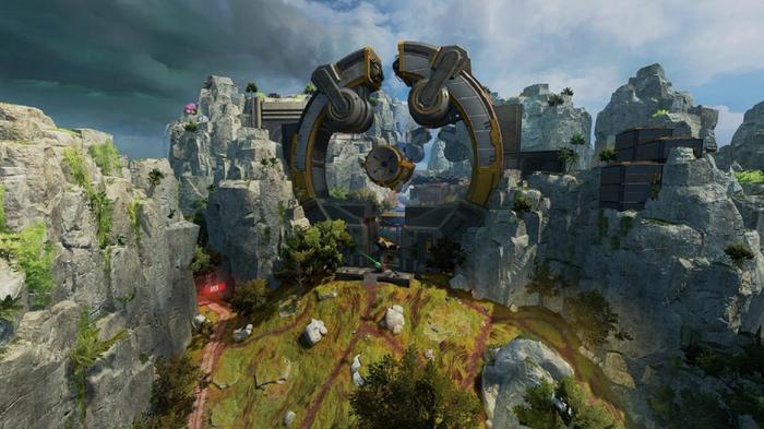 A huge circular building is sandwiched between two mountains in Apex Legends' new map.