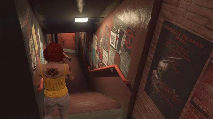GTA Online The Contract Lost MC Stolen Necklace in Tequi-la-la, the player is looking down the stairs that lead to the lower area of the bar. 