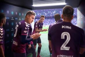 The Football Manager 2022 key art - players prepare for a match in the tunnel.