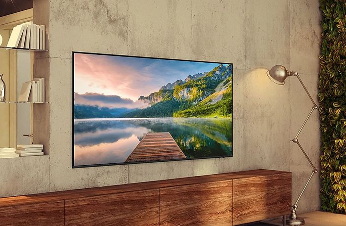 Best gift ideas for gamers - Samsung product image of a flat-screen TV above a brown cabinet.