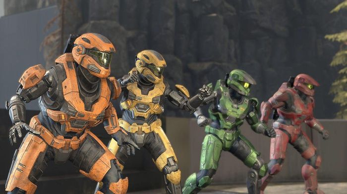 Four Spartan soldiers are preparing to fight. 