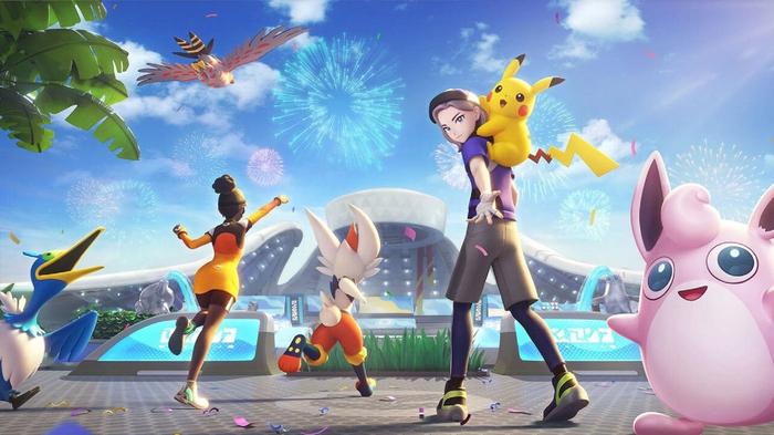 Pokémon and trainers move towards a stadium, with fireworks bursting in the sky above.
