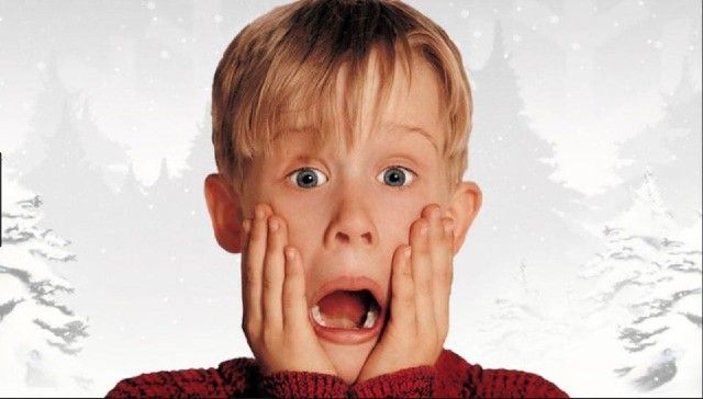 Kevin McCallister holding face on white background