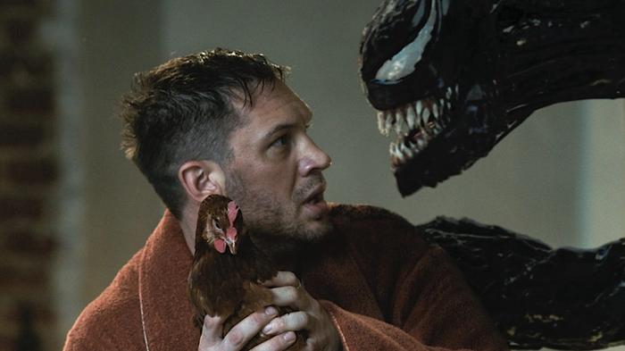 Venom and Eddie Brock are looking at each other.