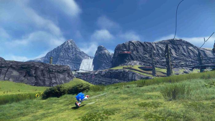 Sonic running through a grassy field in Sonic Frontiers.