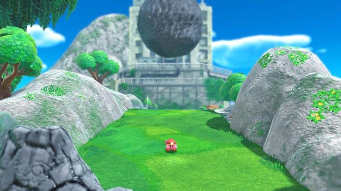 Image of Kirby running away from a boulder in Kirby and the Forgotten Land.