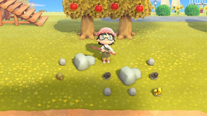 A player standing by a large rock collecting Clay, Stone, Iron Nuggets and Gold Nuggets in Animal Crossing: New Horizons.